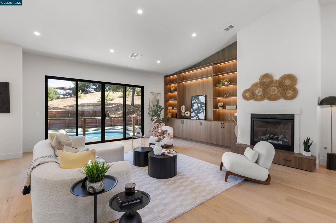 Lancaster living room with illuminated built-in shelving and integrated storage by Millwork USA