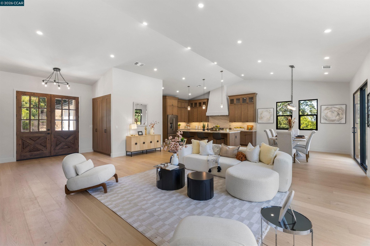 Lancaster living area looking toward the wood kitchen cabinetry and adjoining dining space